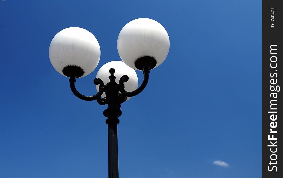 White lamps and blue sky on background. White lamps and blue sky on background