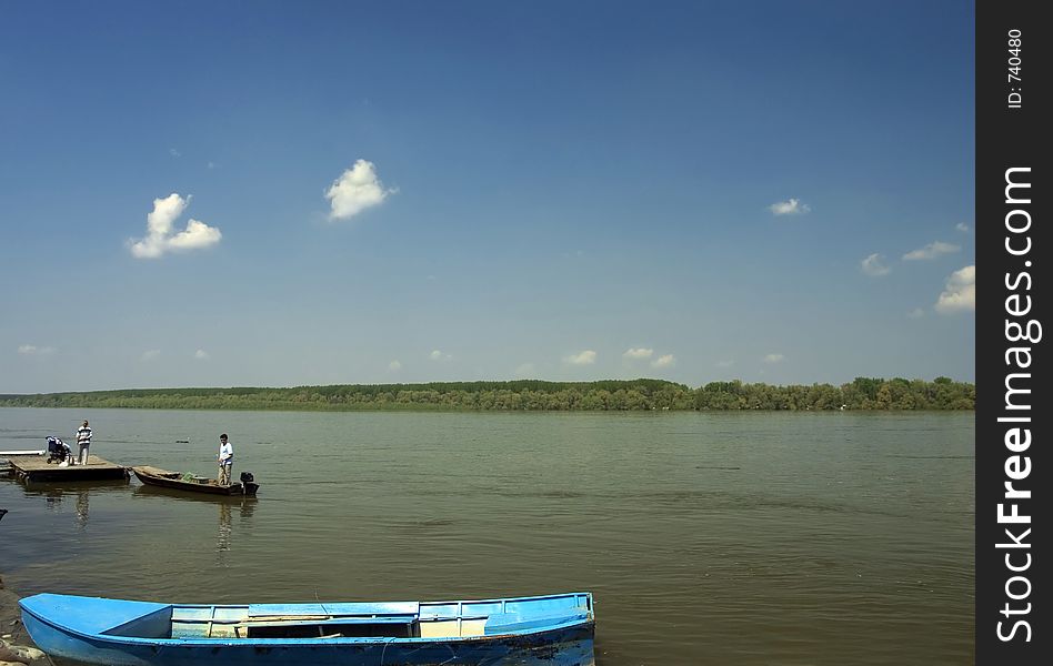 Scene on the river with blue sky in background. Scene on the river with blue sky in background