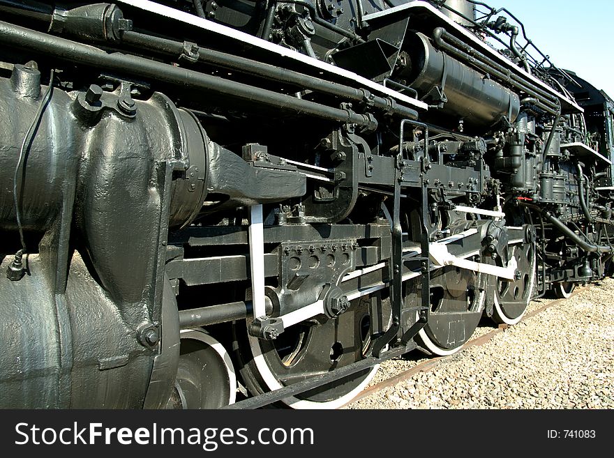 Close up view of wheels of vintage railroad steam locomotive. Close up view of wheels of vintage railroad steam locomotive