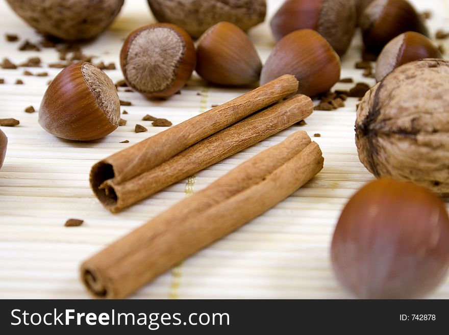 Close-up of cinnamon surrounded by nuts. Close-up of cinnamon surrounded by nuts