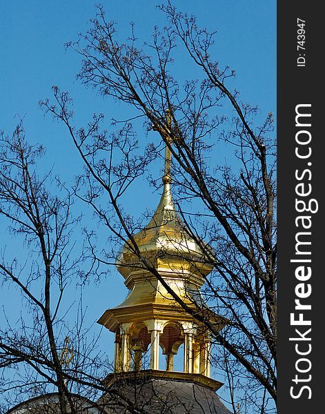 Golden dome and christian cross covered with trees riligious background. Golden dome and christian cross covered with trees riligious background