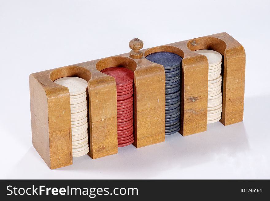 A case filled with antique wooden poker chips. A case filled with antique wooden poker chips