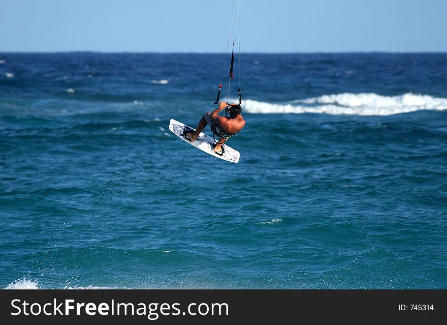 Kite surfer flips in the air. Kite surfer flips in the air.