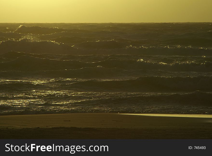 A rough sea in the light of the sunset. A rough sea in the light of the sunset