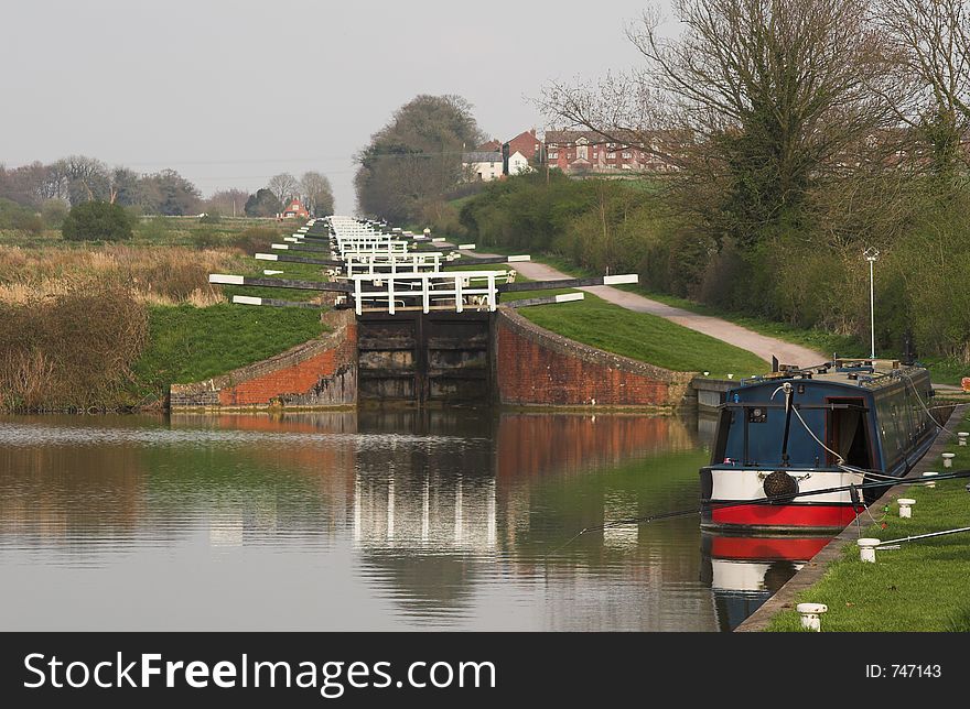 Flight of canal locks with canal boat. Flight of canal locks with canal boat