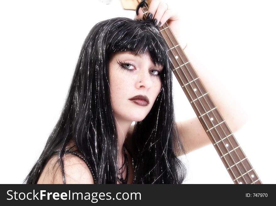 Teen girl bass player in goth fashion. Teen girl bass player in goth fashion.
