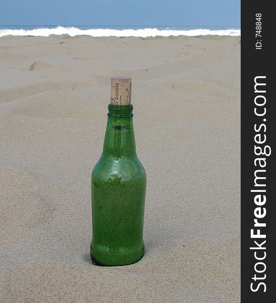 A Message in a bottle on a beach