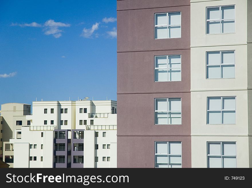 Hotel building on a blue sky background. Hotel building on a blue sky background