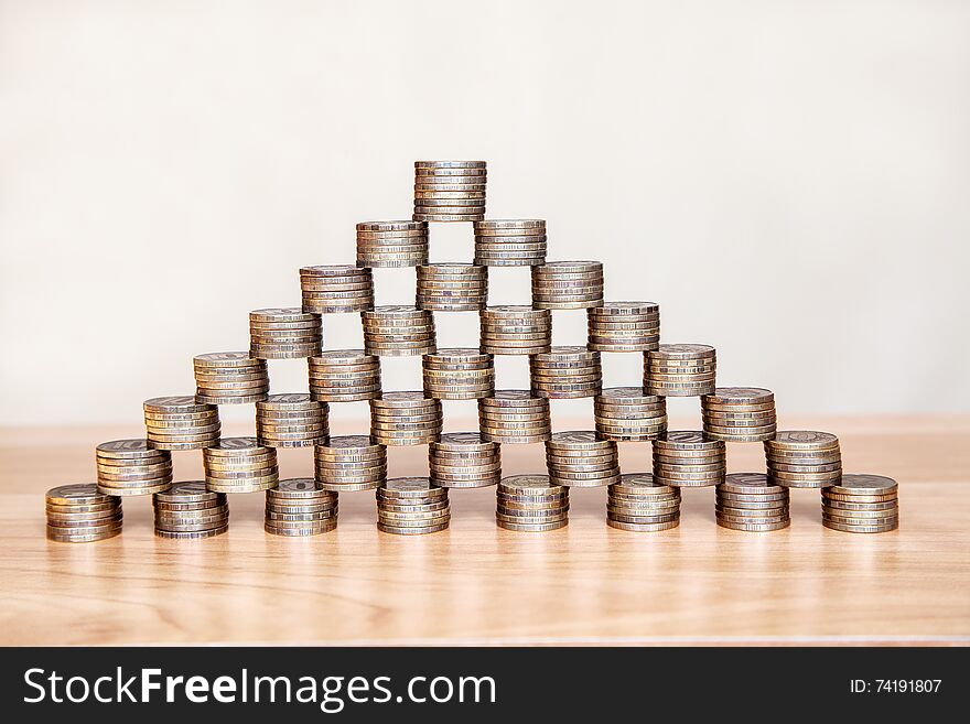Pyramid of the coins on the table