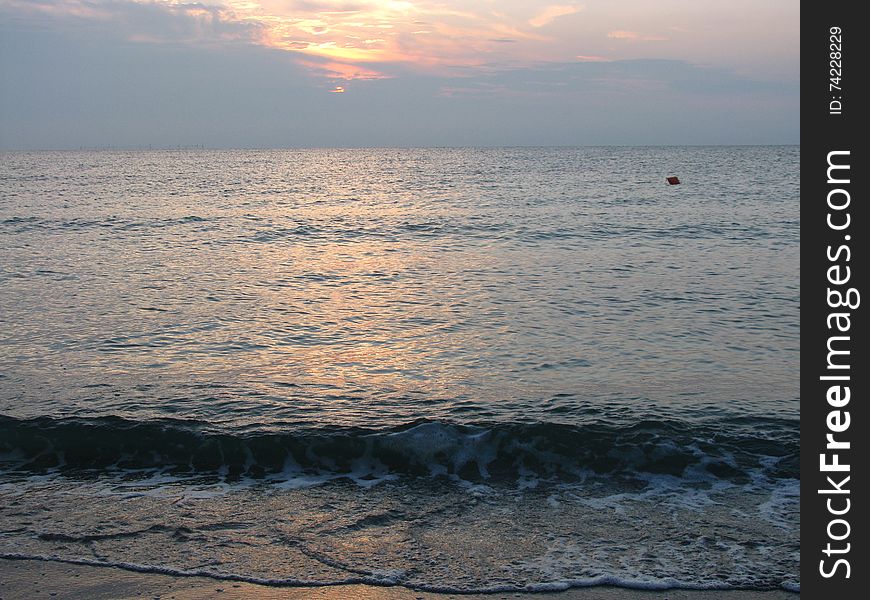 View of the beautiful and calm sea, at sunrise. View of the beautiful and calm sea, at sunrise.