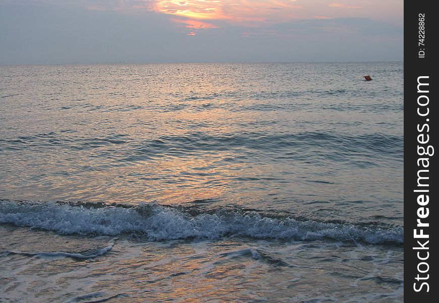 View of the beautiful and calm sea, at sunrise. View of the beautiful and calm sea, at sunrise.