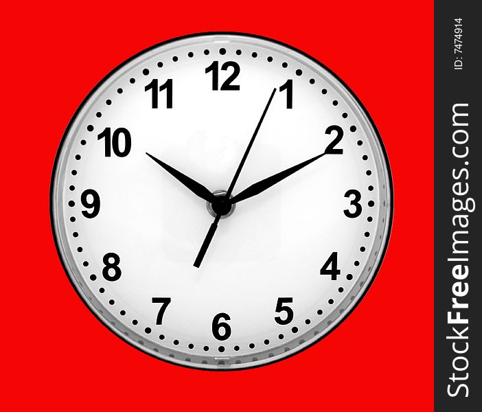 Dial of clocks with arrows on a red background.