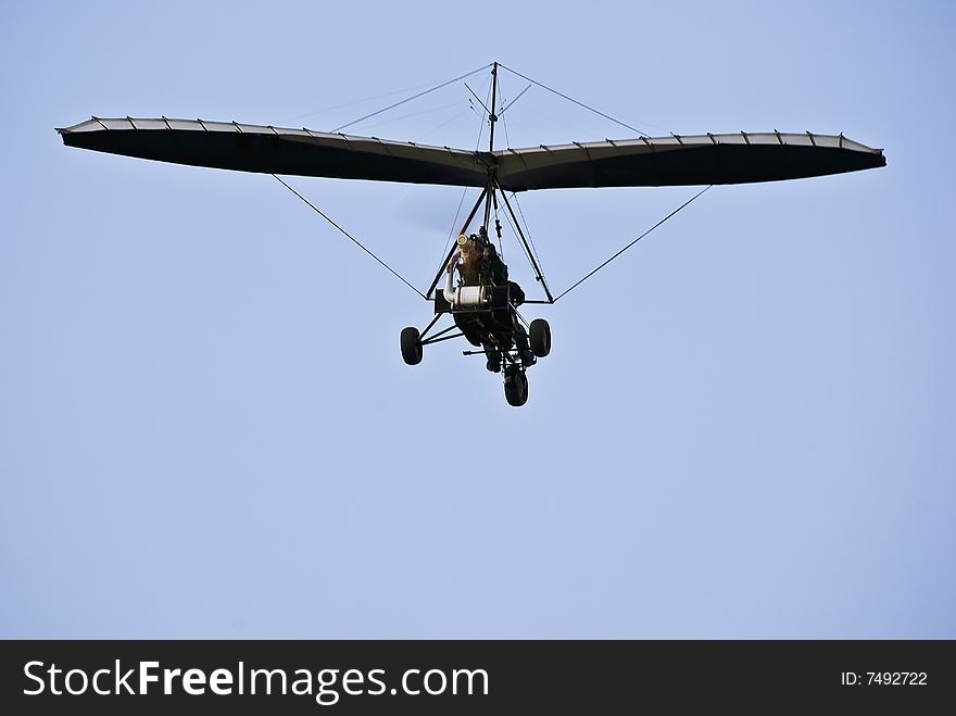 Motorized Hang Glider in Flight - Rear View