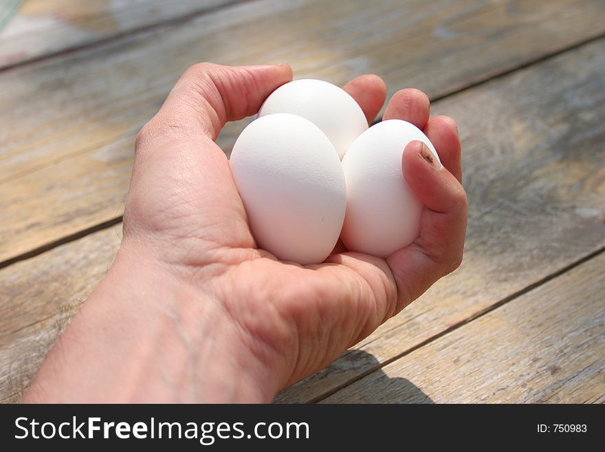 Hand with three eggs. Hand with three eggs