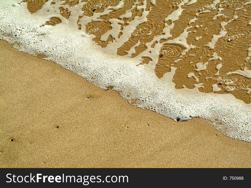 Diagonal wave in sand beach. Diagonal wave in sand beach