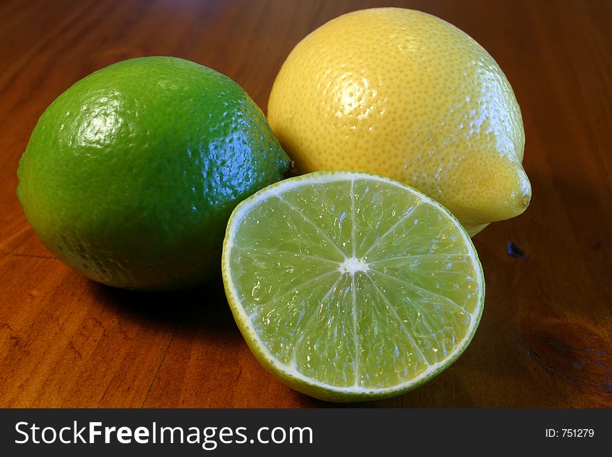 Lemon and Lime on wooden table. Lemon and Lime on wooden table