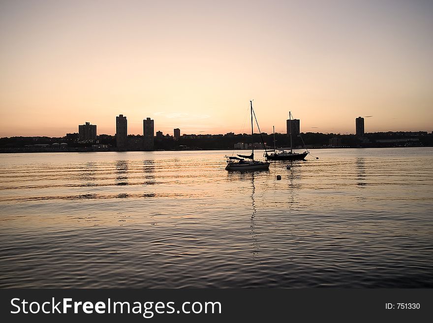 Quiet evening on Hudson river, New Jersey skyline. Quiet evening on Hudson river, New Jersey skyline.