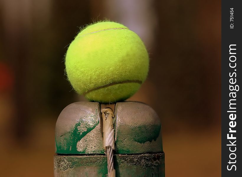 Tennis ball on top of the pole. Tennis ball on top of the pole