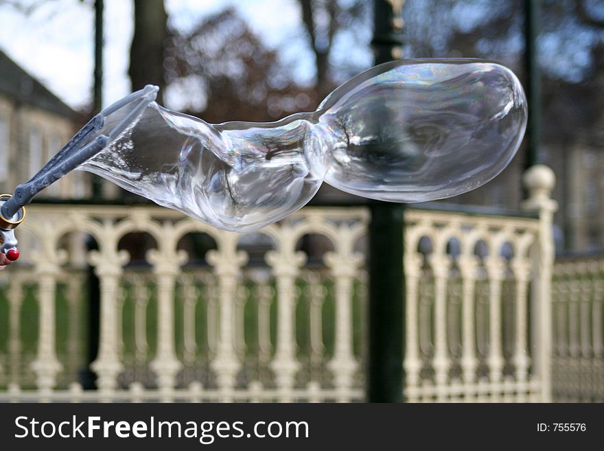 Child makes bubbles in the park. Child makes bubbles in the park