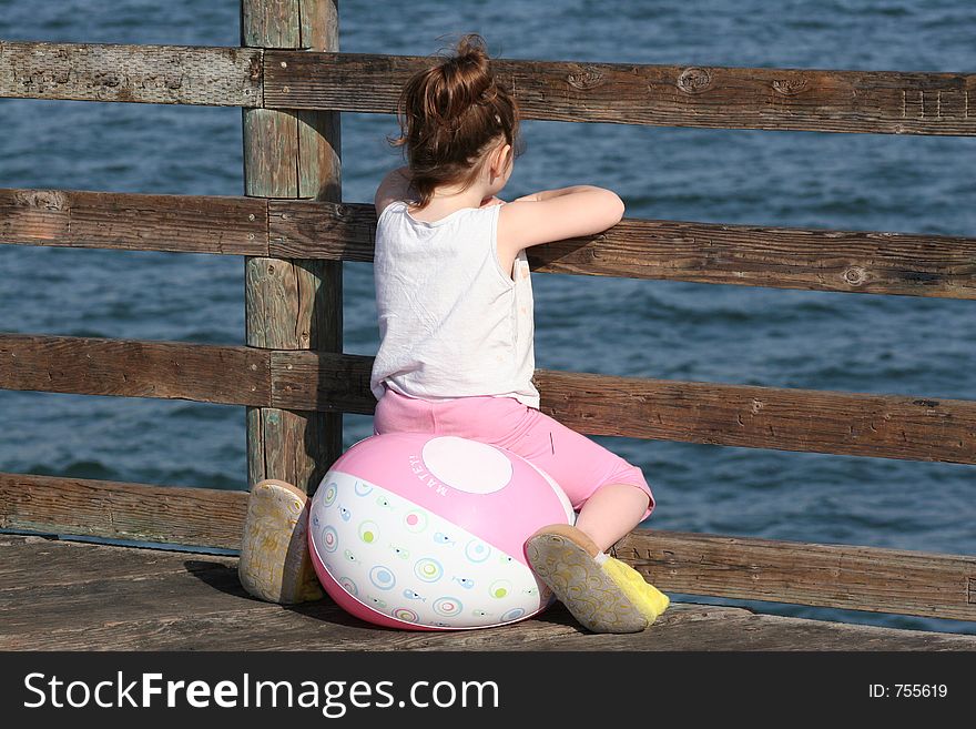 Little Girl On Pier
