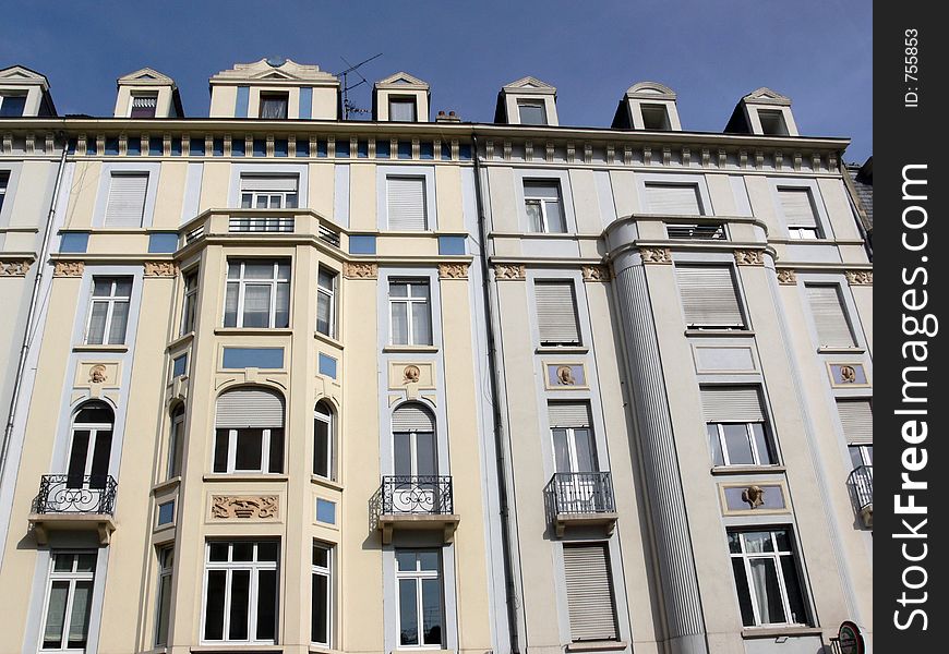 House facade in France in front of blue sky