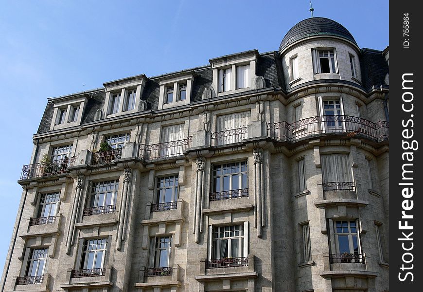 House facade in France in front of blue sky