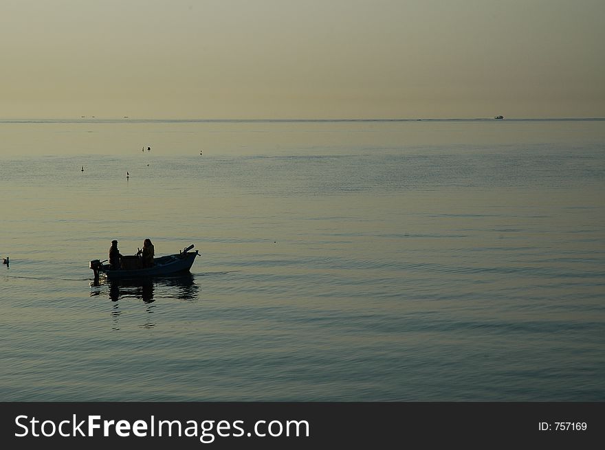 Fishing at sunrise in a bay in manfredonia italy. Fishing at sunrise in a bay in manfredonia italy