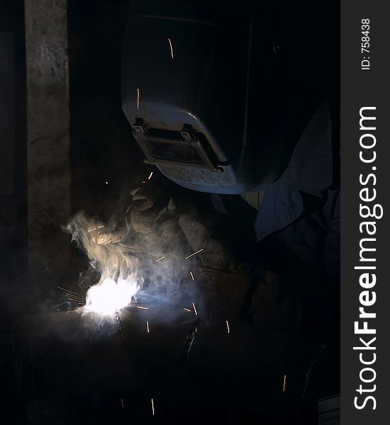 Welder working in smoke