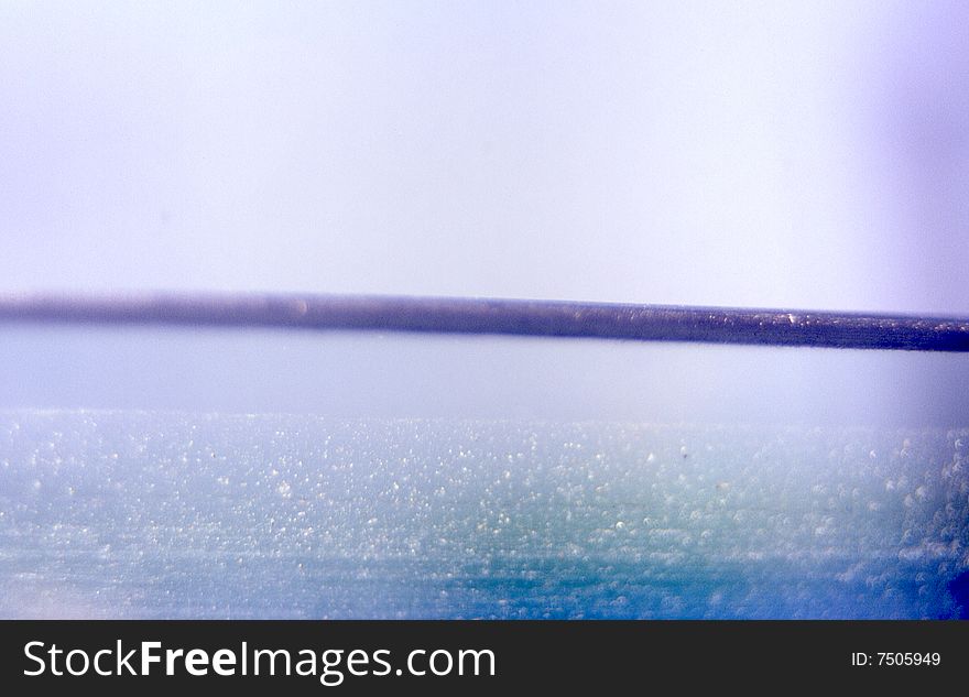 Glass window grainy abstract aqua textured background with dark horizontal line. Glass window grainy abstract aqua textured background with dark horizontal line