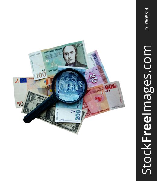 Magnifier on different banknotes in the blur