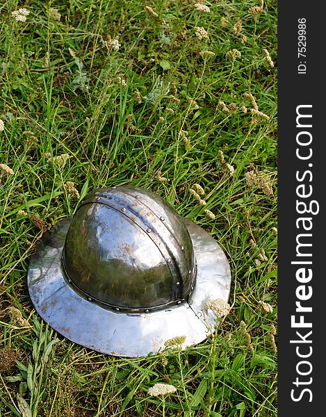 Helmet of teutonic infantry lying on the grass