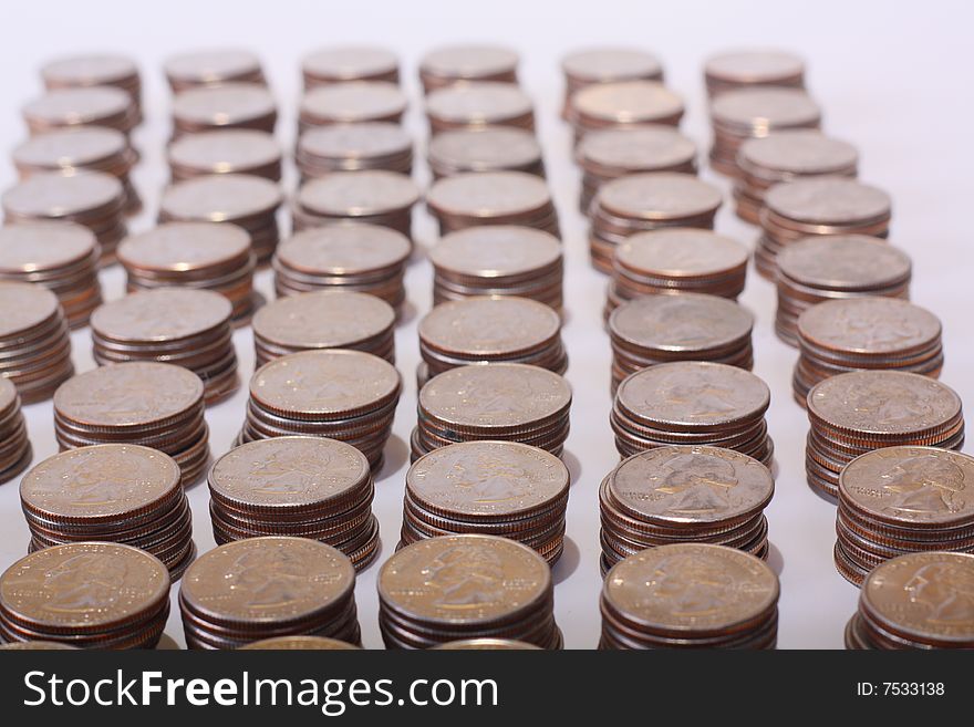 Stacks of quarters with George Washington showing on each.