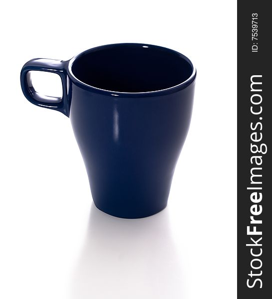 Blue ceramic mug isolated on a white background with a shadow. Blue ceramic mug isolated on a white background with a shadow.