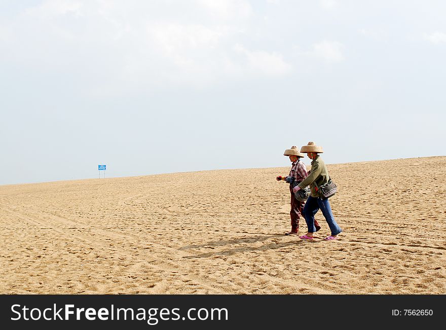 Two women walked the beach