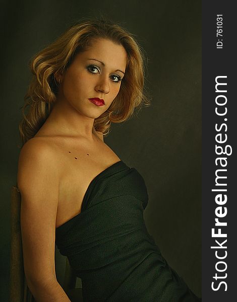 Portrait of the beautiful girl in a black dress. Portrait of the beautiful girl in a black dress.