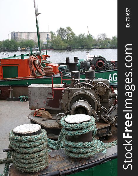 Barge moored near riverside