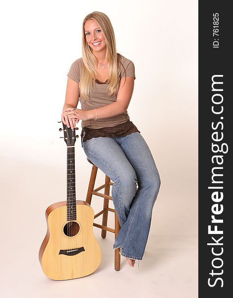 Blonde posing with guitar. Blonde posing with guitar