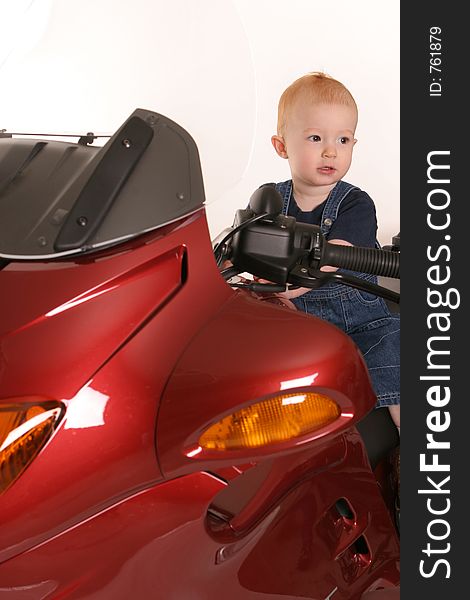 Little redhead on red motorcycle. Little redhead on red motorcycle