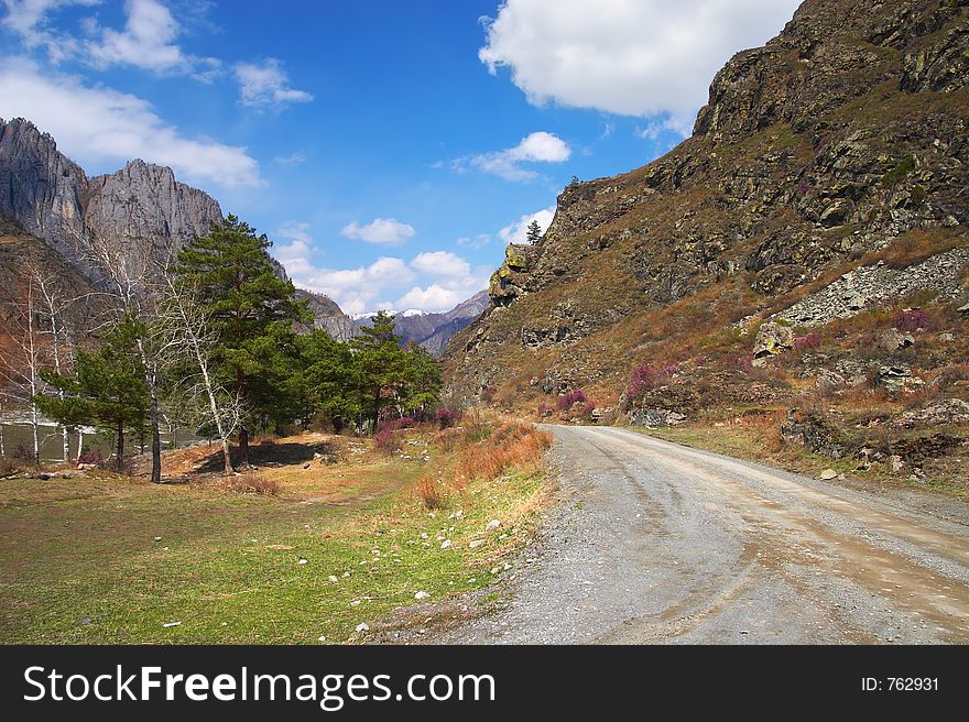 Road, mountains and skies.