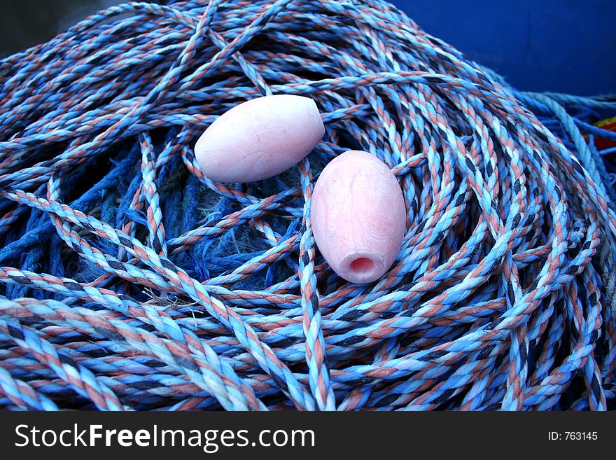 Close Up Of Floats And Fishing Rope.