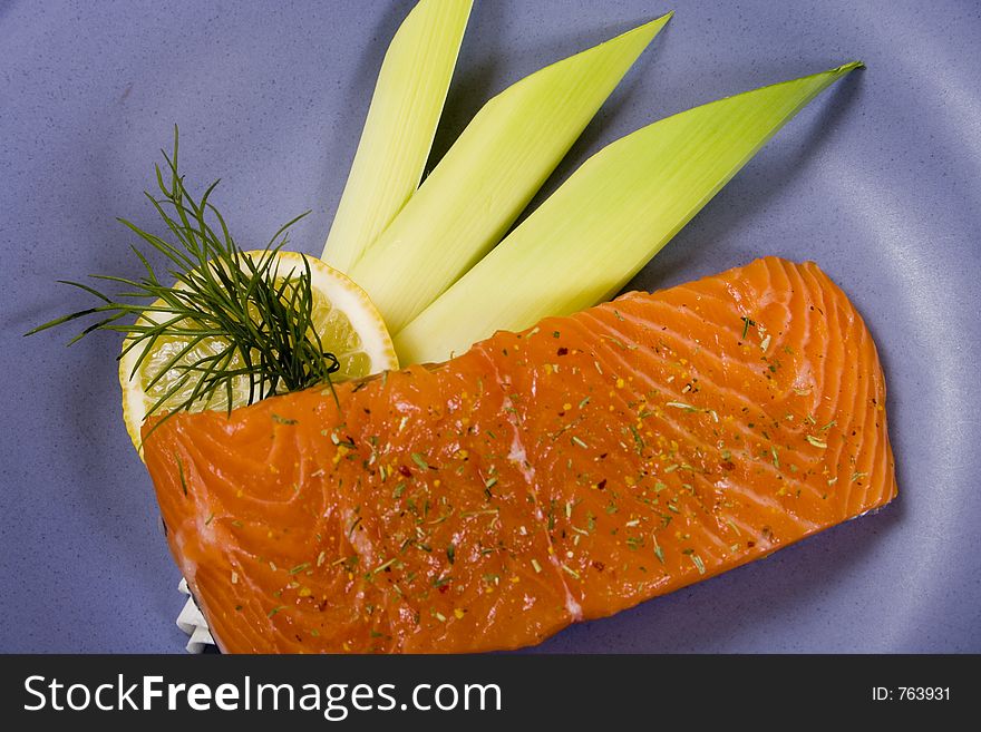 Raw salmon steak with leek and lemon. Raw salmon steak with leek and lemon