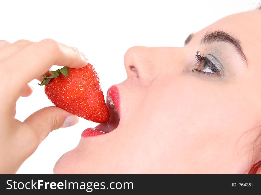 Girl eating strawberry. Girl eating strawberry