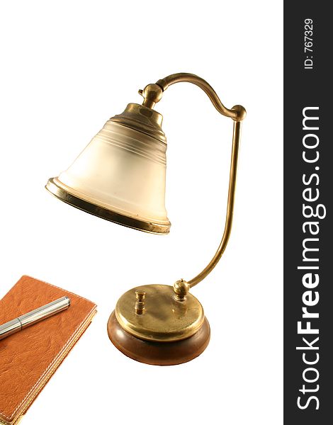 Brass lamp and agenda. Brass lamp and agenda