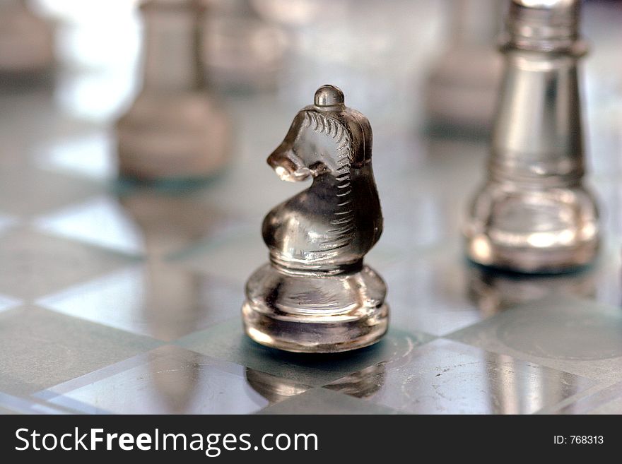 Chess figure on a battle field