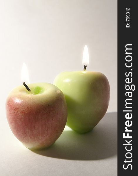 Burning candles simulating apples. Burning candles simulating apples