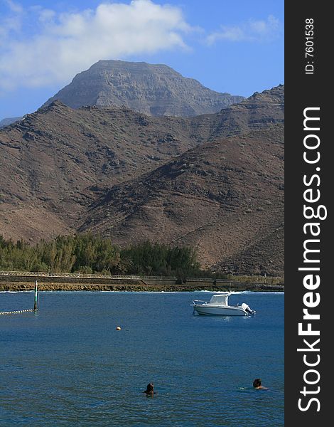 Nice bath at fishing harbor of the city of san nicolas in the gran canaria island. Nice bath at fishing harbor of the city of san nicolas in the gran canaria island