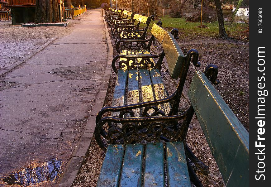 Romantic alley in the park with benches along the side. Romantic alley in the park with benches along the side