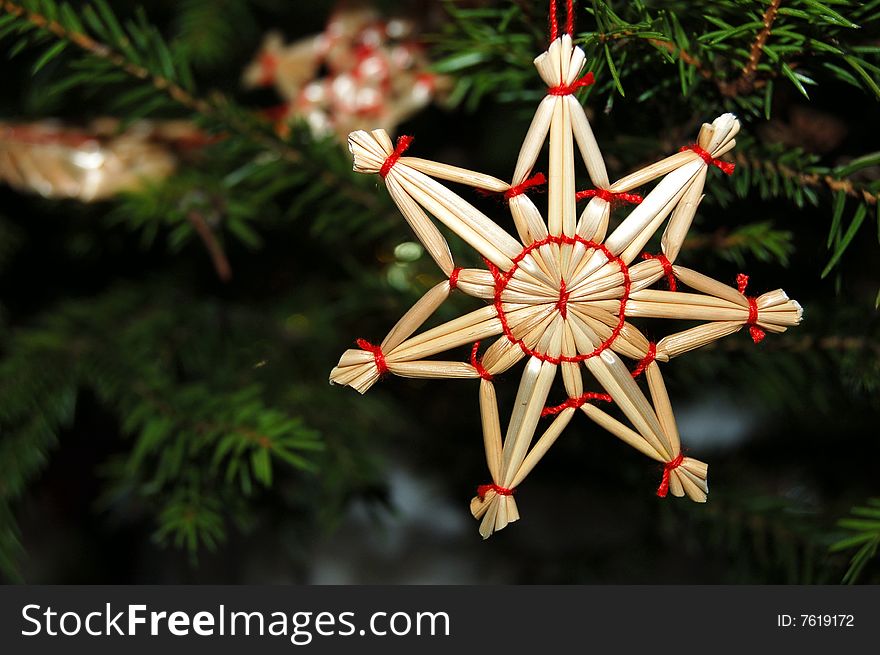 A straw star on the Christmas Tree