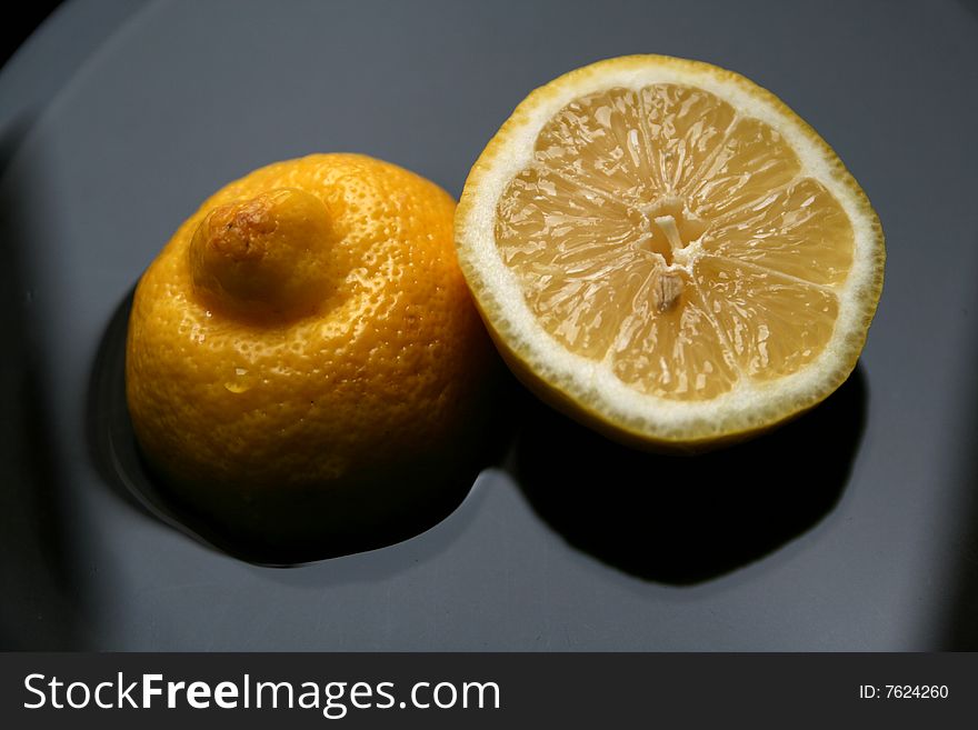 A lemon cut in two