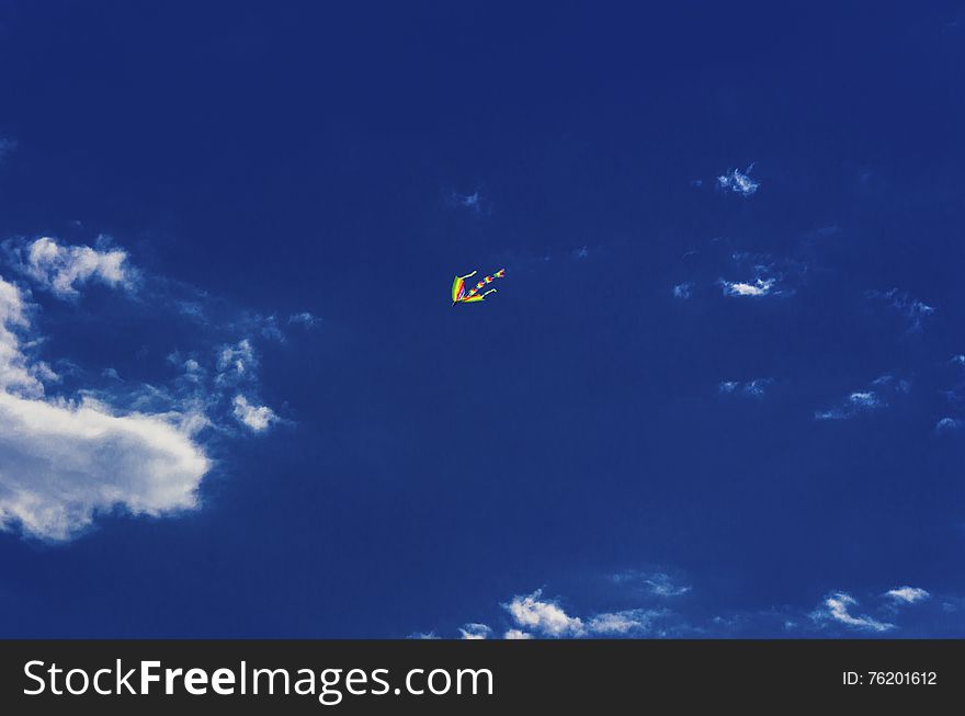 Colorful kite flying in the blue sky. Colorful kite flying in the blue sky